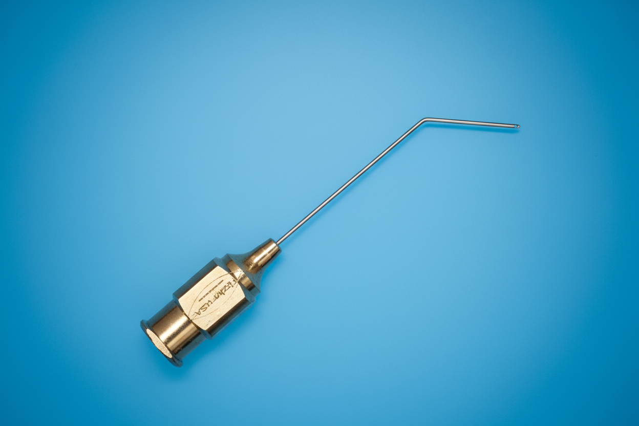 DMEK cannula with L-shaped needle and gold hub on cobalt blue background