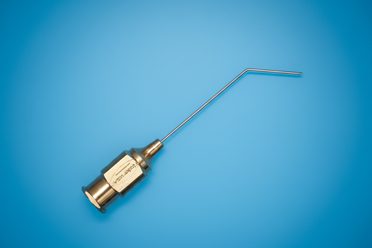 DMEK cannula with L-shaped needle and gold hub on cobalt blue background